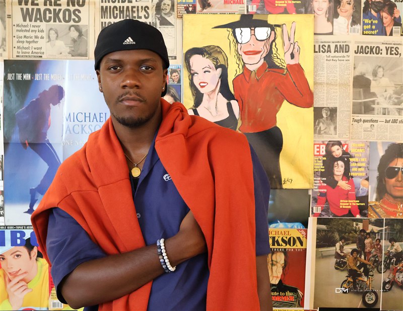 Portrait in front of a music magazine wall